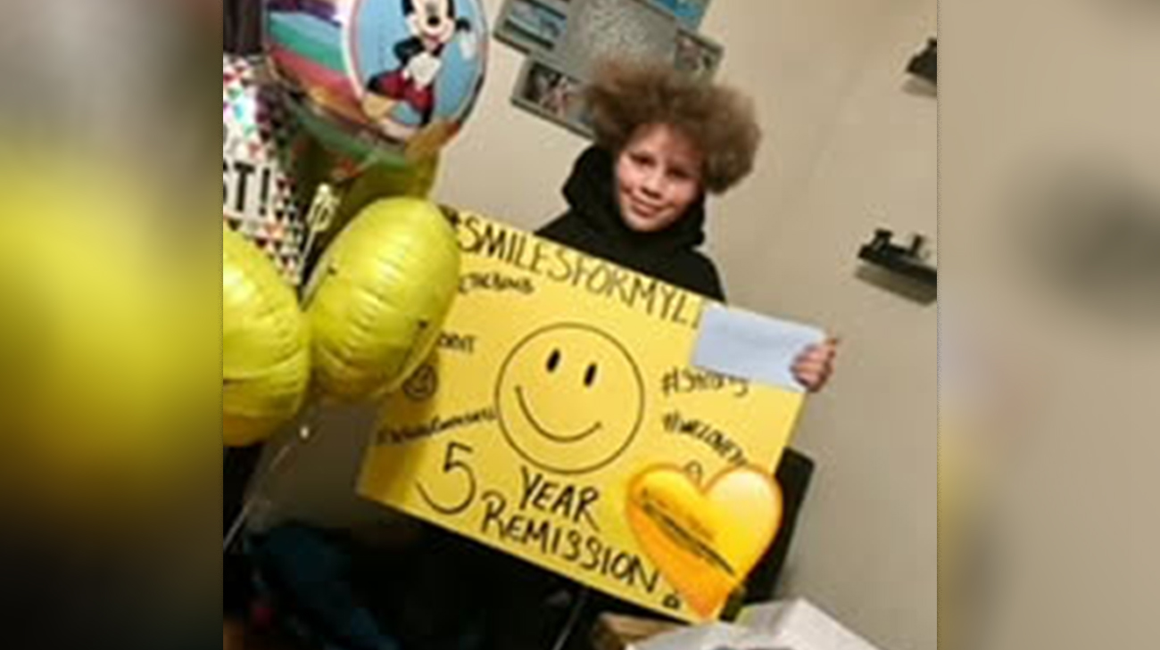 Myles celebrating five years of remission from a type of bone cancer.