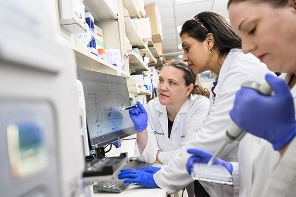 Jeanette Messer, DVM, PhD in the lab with her team