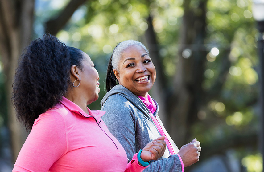two women walking outside